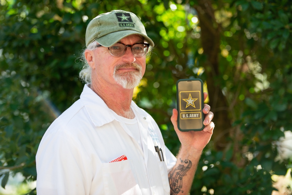 A person holding a plaque  Description automatically generated with low confidence