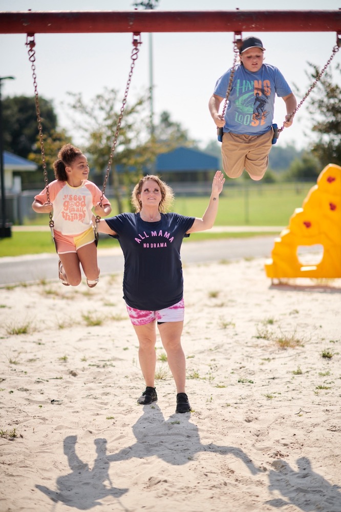Brittany and children on swings