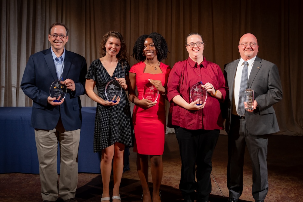 5 ICARE Award recipients pose with awards