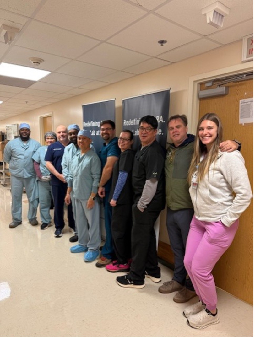 Salus and TMH teams pose in hallway