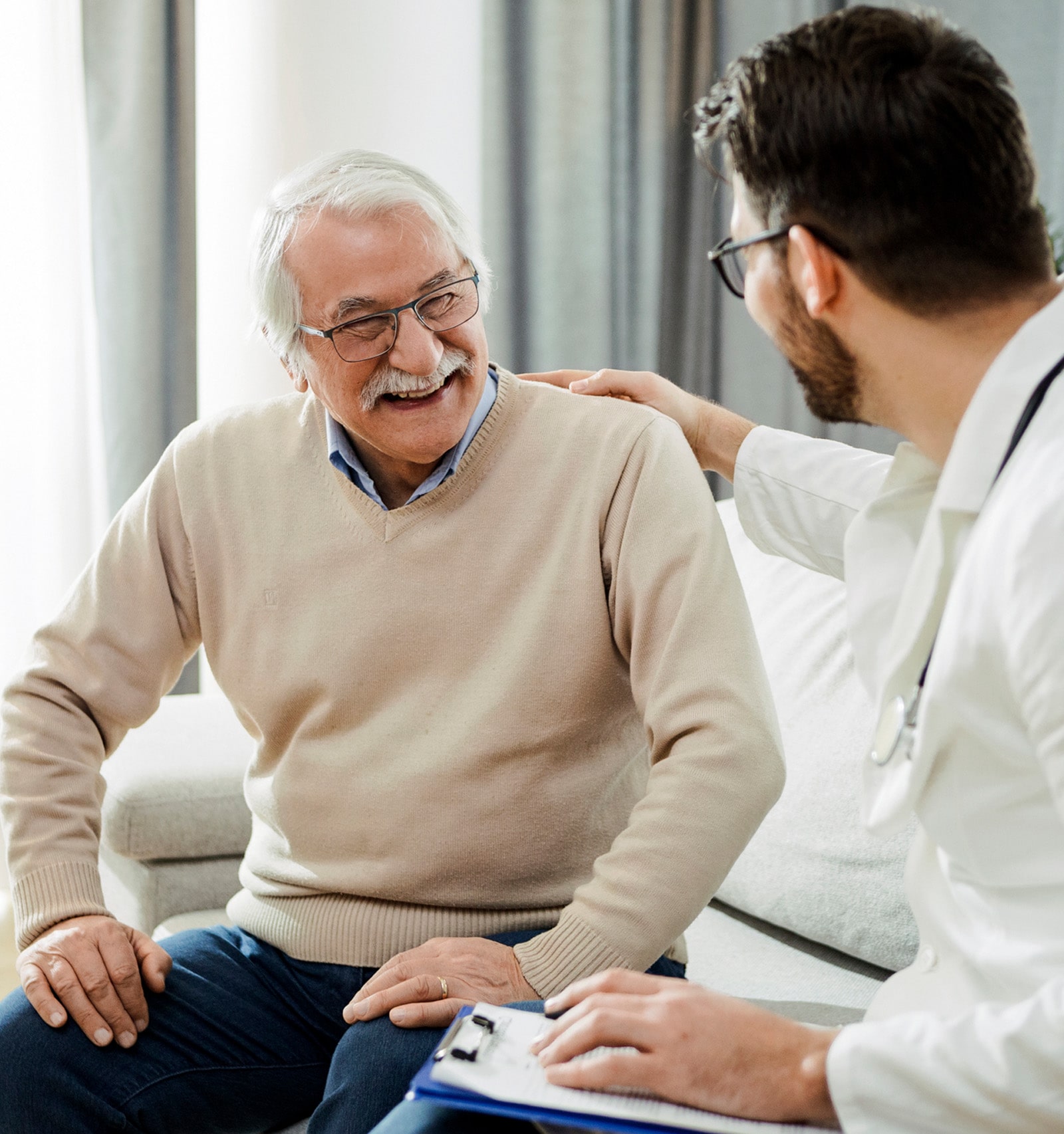 A doctor speaking with an older man