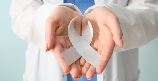 two hands holding a white ribbon