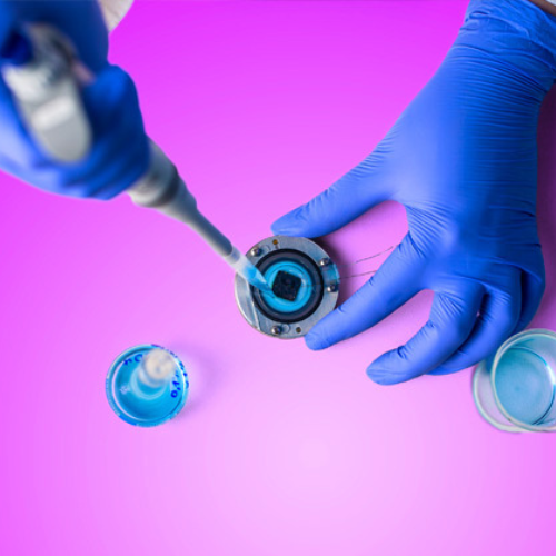 Scientist using dropper tool