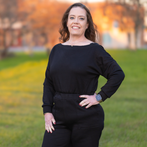 Kelly smiling outside