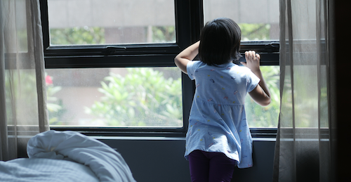 Child looking out of window