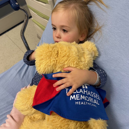 Lilly holding Superpup