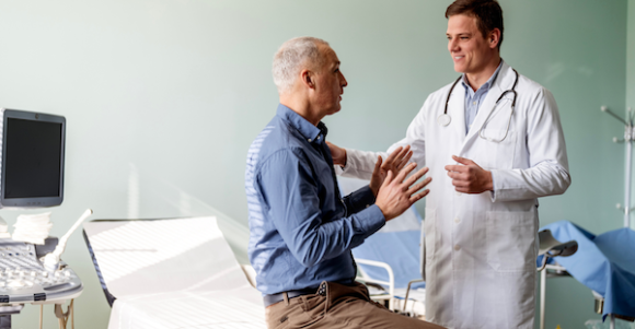 man talking with male doctor