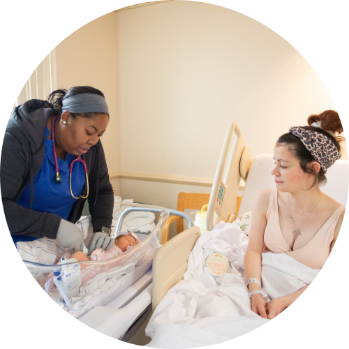 Nurse, baby and mother after delivery